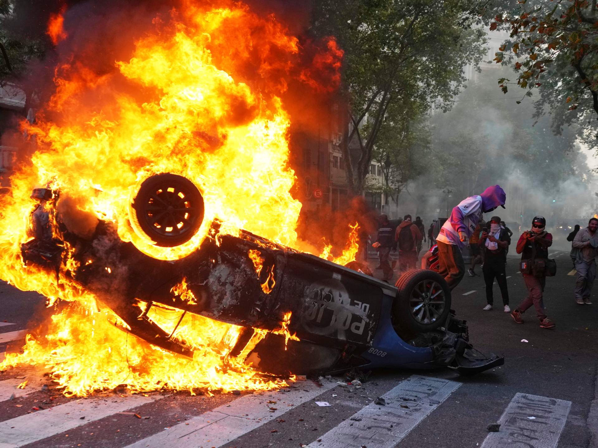 Football diehards and Argentinian retirees protest pension reform | Protests News