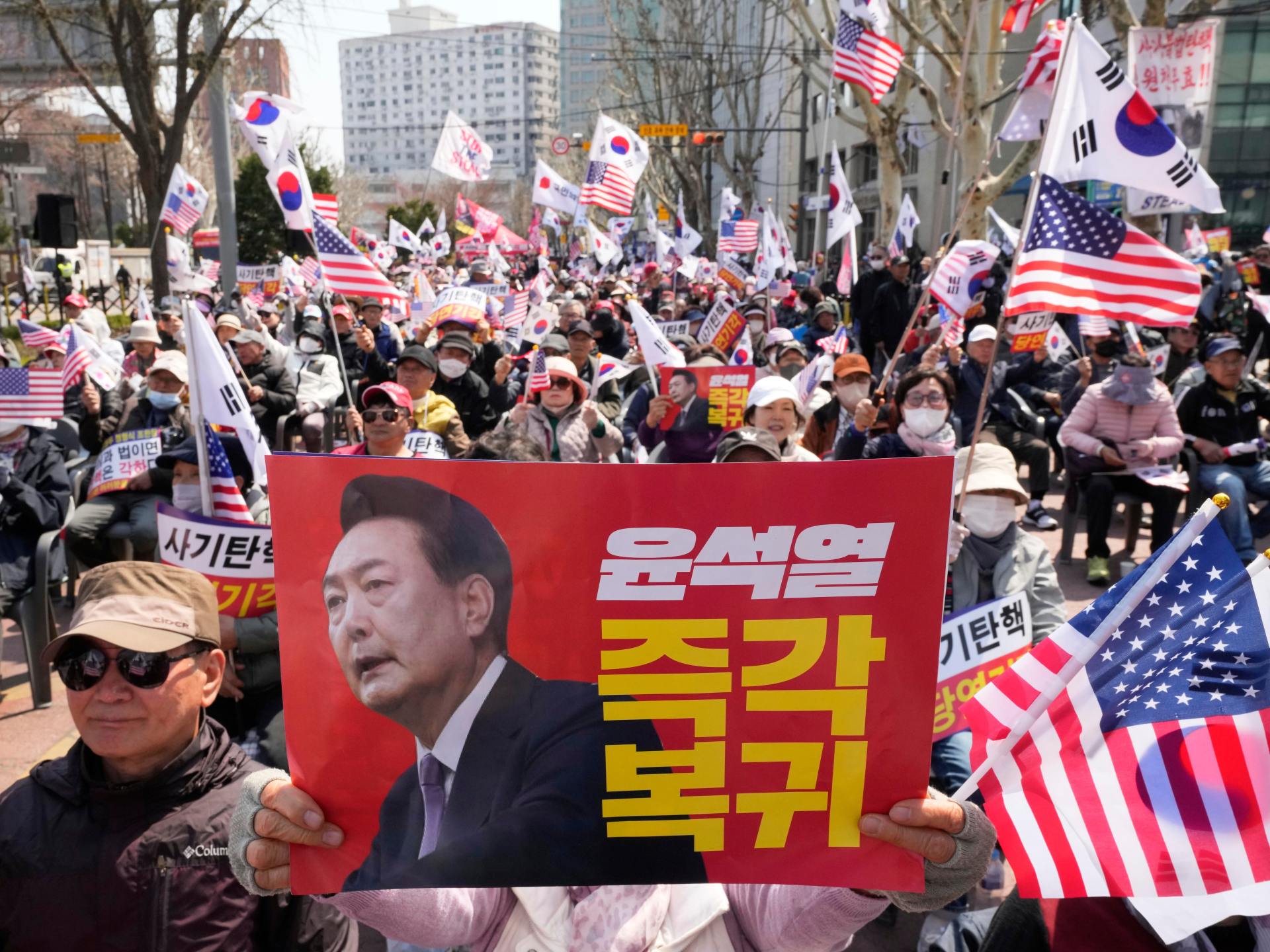 Downtown Seoul tense as court due to rule on President Yoon’s impeachment | Politics News